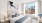 Bedroom with views of downtown Boston at Watermark Seaport
